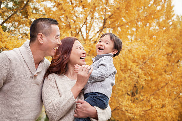 istock Family Enjoying a Park in Autumn 455669691