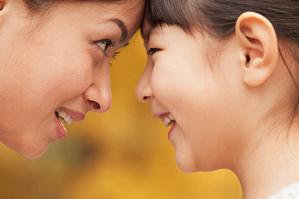 istock Mother and Daughter face-to-face 455670045