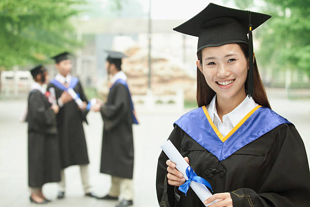 istock Young Female University Graduate, Portrait with Diploma 455670623