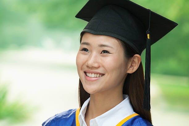 istock Young Woman Graduating From University, Close-Up Vertical Portrait 455670695