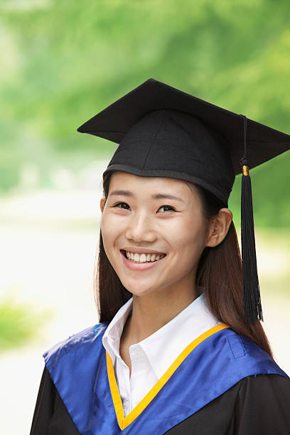 istock Young Woman Graduating From University, Close-Up Vertical Portrait 455670713