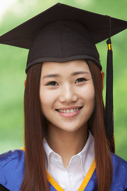 istock Young Woman Graduating From University, Looking-Up Horizontal Portrait 455670797