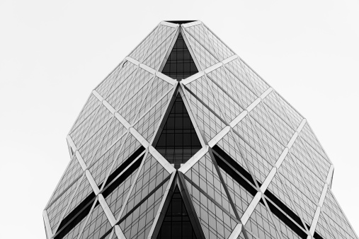 Black and white low angle view of the modern Hearst Corporation building in Upper Manhattan, New York City.
