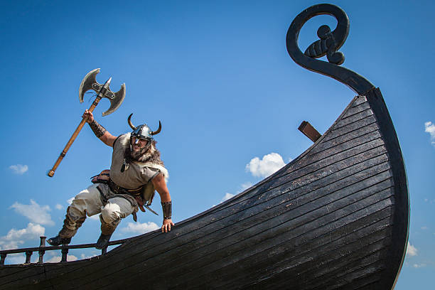 Strong Viking jumping from his ship to attack Developed from RAW. retouched with special care and attention. viking ship photos stock pictures, royalty-free photos & images