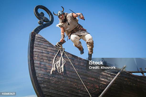 Strong Viking Jumping From His Ship To Attack Stock Photo - Download Image Now - Viking, Viking Helmet, Helmet