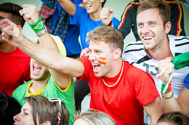 istock Fans of different nations at the stadium together 455684941