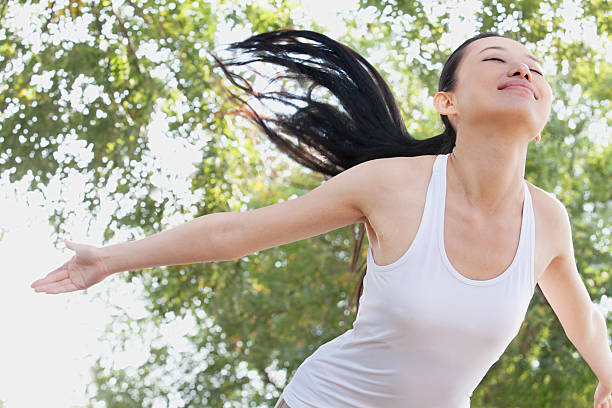 istock Relaxed Young Woman in Park 455686541