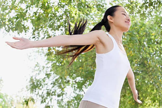 istock Relaxed Young Woman in Park 455686651