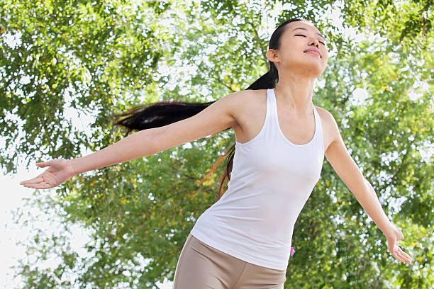 istock Relaxed Young Woman in Park 455686675
