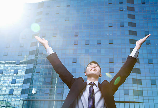 istock Young Businessman with arms raised 455687773