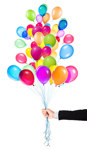 istock flying balloons with Businessman hand 455699261