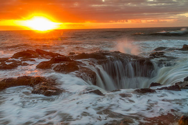 istock Thor's Well Crashing Waves at sunset 455699801