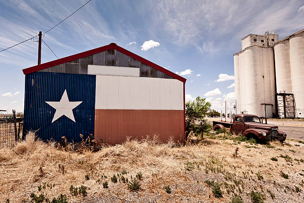 Abandoned restaraunt and old style car near gas station on the famous route 66 road in USA