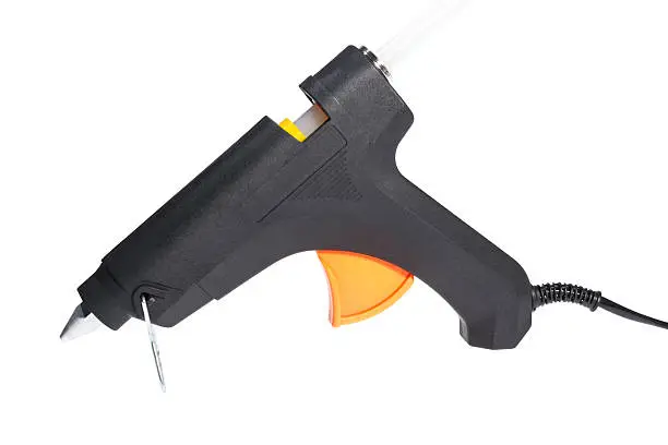 Electric hot glue gun isolated on a white background.