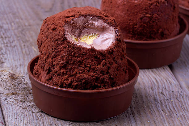Ice cream, tartufo over wooden background