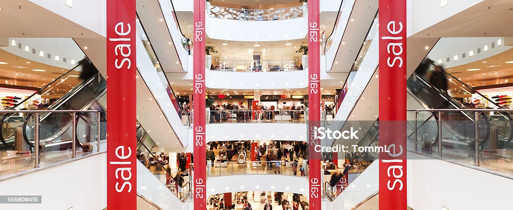 Sale Banner in Mall "Sale" banner inside modern shopping mall. Sale Stock Photo