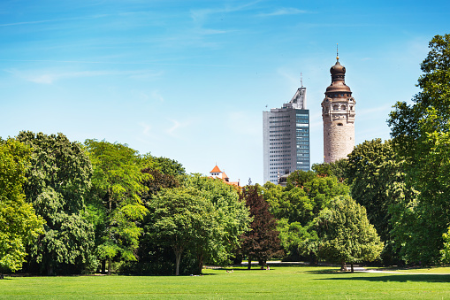 Clara Zetkin Park in Leipzig, Germany with new town hall and university tower (Uniriese) in background.