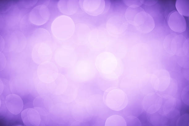 istock Bokeh display of blurred lighting on a purple background 455849329