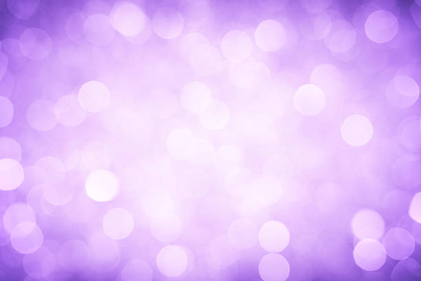 istock A background of bright purple defocused lights 455849625