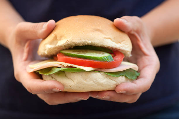 istock Homemade hamburger in woman's hands 455851389