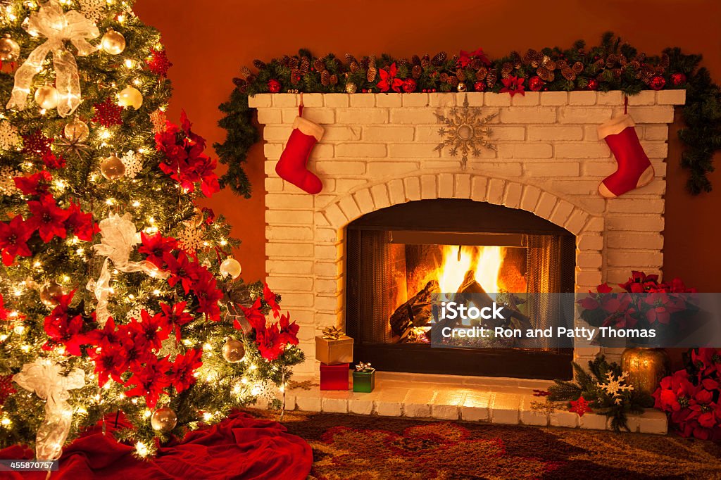 Old fashioned Christmas Fireplace and Tree (P) Old brick fireplace with Christmas decorations. Christmas Stock Photo