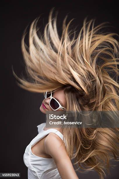 Blonde Fashion Model In White Sunglasses Whipping Her Hair Stock Photo - Download Image Now