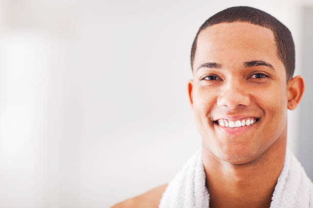 Young  African American man shaving. More files of this model and series on port.