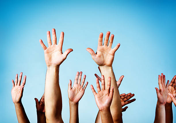 istock Me! Many hands raised in response or to volunteer 455985991