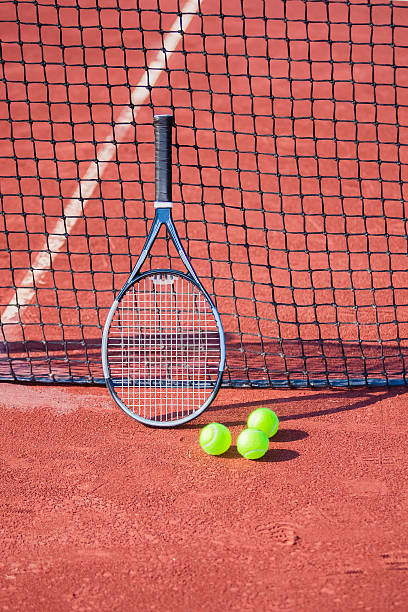 istock Tennis racket and balls against a net. 456003585