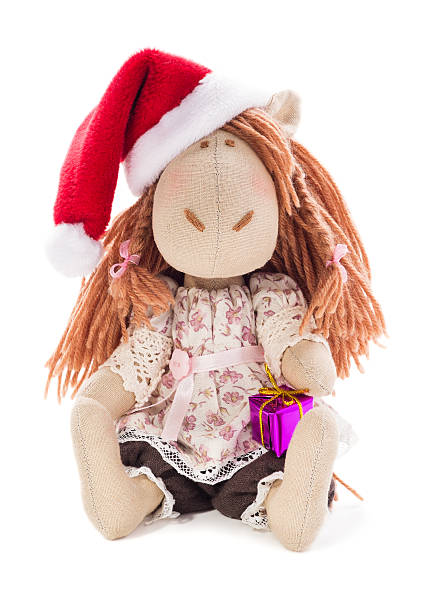 istock Symbol 2014, textile horse with gift on a white background 456006461