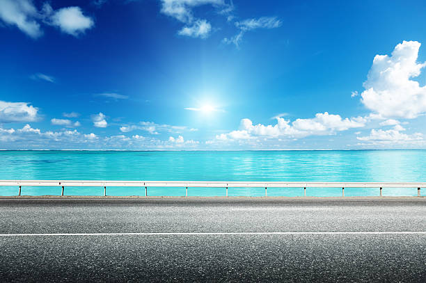 istock asphalt road and sea 456007419