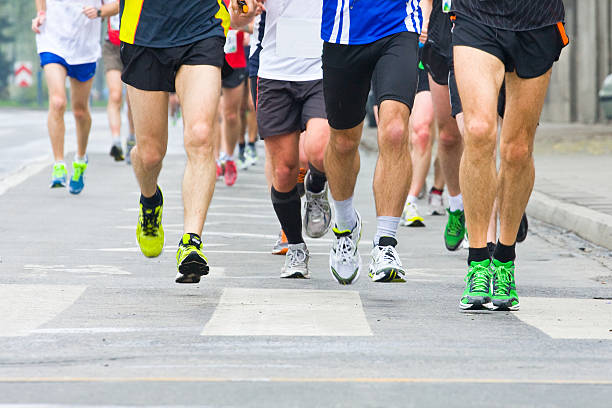 istock People running in city marathon 456007567