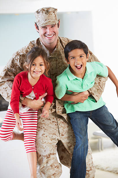 istock Children Greeting Military Father Home On Leave 456009243