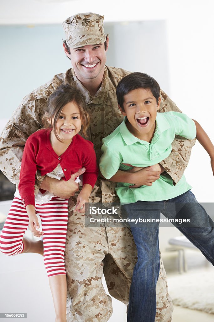 Children Greeting Military Father Home On Leave Children Greeting Military Father Home On Leave And Smiling To Camera Child Stock Photo