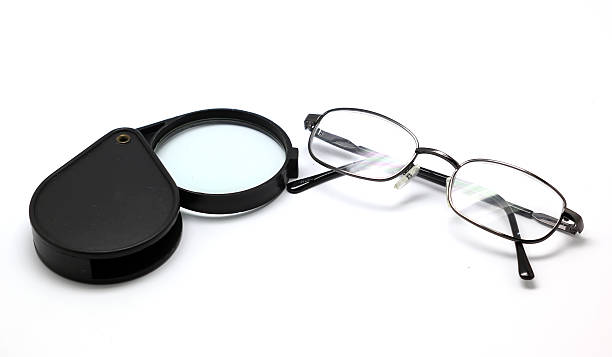 istock eye glasses and magnifying glass isolated on white 456010411