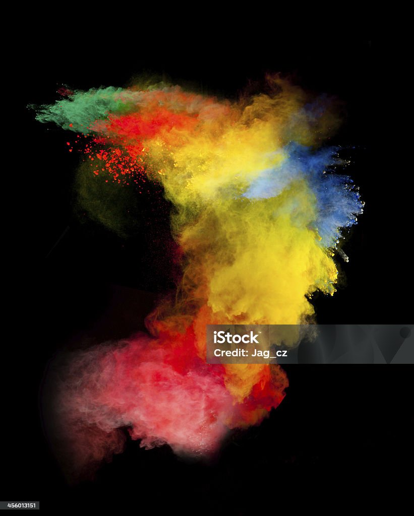 colored dust Freeze motion of colored dust explosion isolated on black background Abstract Stock Photo