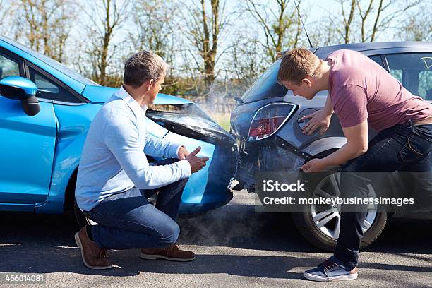 Two Drivers Arguing After Traffic Accident Stock Photo - Download Image Now - Car Accident, Car Insurance, Car