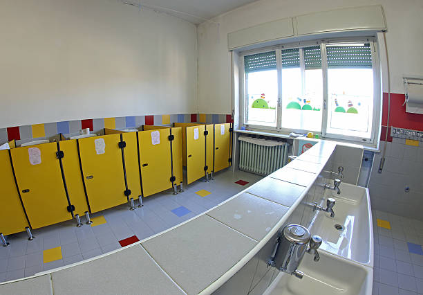 istock bathroom of a nursery with the wc and tiny sinks 456015213