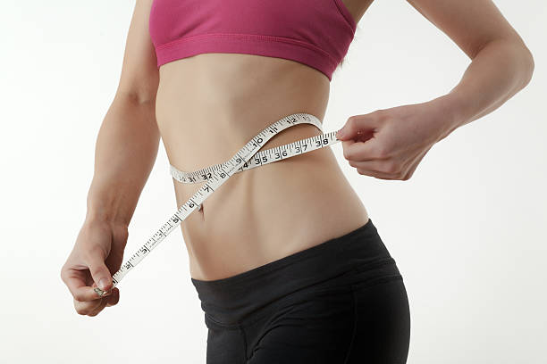 istock Hand measuring waist 456021207
