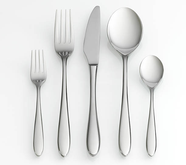 Fork, knife and spoon set Fork, knife and spoon set on white background with clipping path eating utensil stock pictures, royalty-free photos & images
