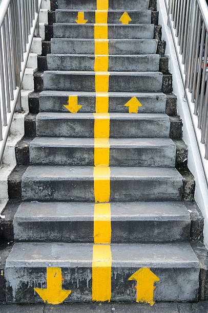 istock Flyover stairs with up and down yellow arrows 456026131