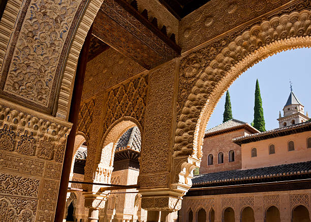 Detail of Ornate Decoration at Alhambra Palace in Granada, Spain Detail of ornate decoration at Alhambra Palace in Granada, Spain. This photograph was taken at the entrance to Patio de los Leones (Court Of The Lions). circa 14th century photos stock pictures, royalty-free photos & images
