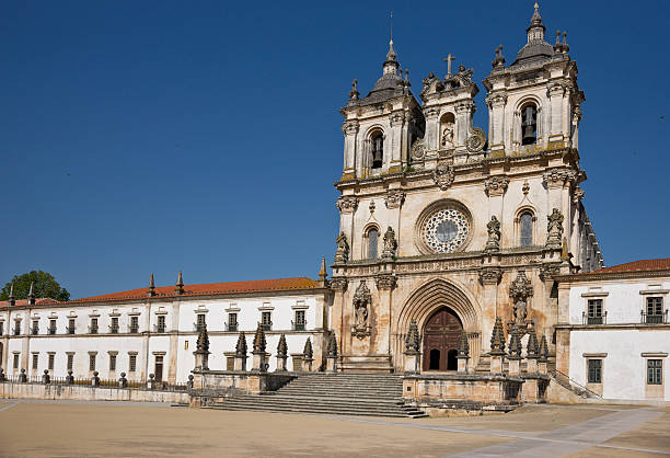 Facade Monastery of Alcobaca, Portugal The Alcobaça Monastery (Mosteiro de Santa Maria de Alcobaça) is a mediaeval monastery located in the town of Alcobaça, in central Portugal.  alcobaca photos stock pictures, royalty-free photos & images