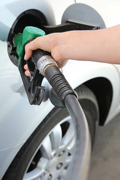 istock Gas Station Refill Hand and Nozzle 456027243