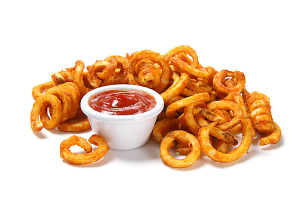 Seasoned Curly Fries Seasoned curly fries with ketchup. curly fries stock pictures, royalty-free photos & images