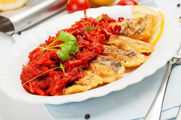 istock Pieces of fried fish with vegetable marinade. 456028753