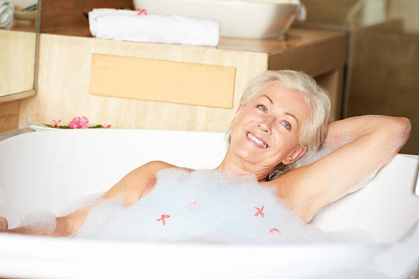 istock Senior Woman Relaxing In Bubble Bath 456031903