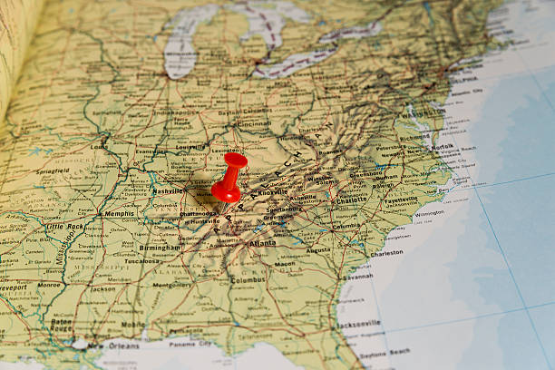 Chattanooga Marked with Red Pushpin on Map Chattanooga marked with red pushpin on map. Selected focus on Chattanooga and bright red puspin. Pushpin is in an angle. Surrounding states and Nashville can also be seen. tennessee map stock pictures, royalty-free photos & images