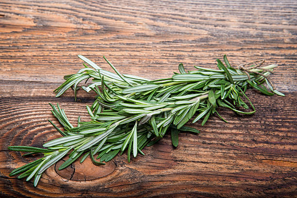istock Fresh rosemary bound on a wooden board 456048453