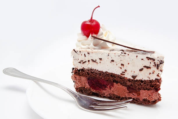 istock Slice of chocolate cake with cherry on the plate isolated 456048775